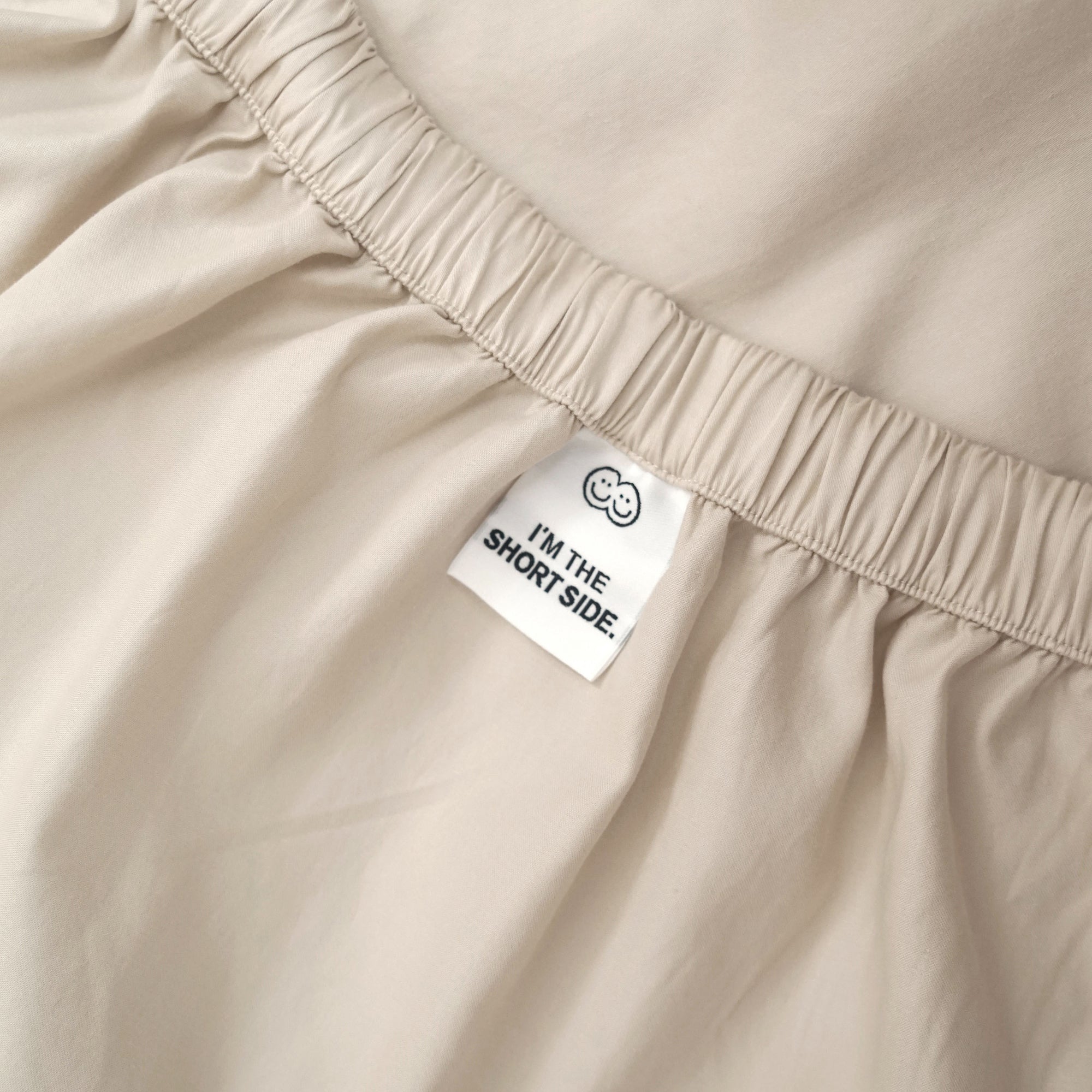 Roomie oat organic cotton fitted sheet with guide tag