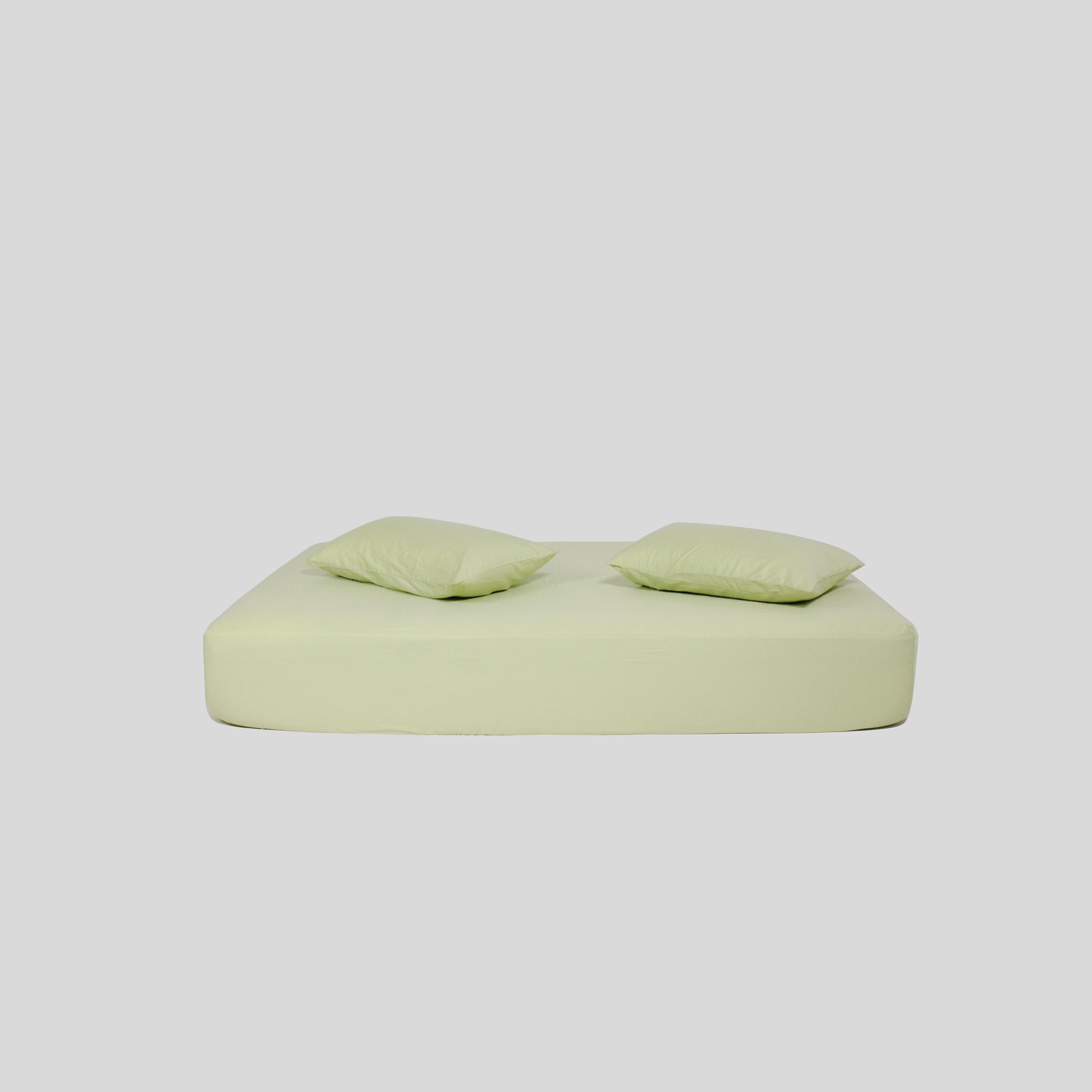 Roomie matcha green organic cotton fitted sheet with two pillows